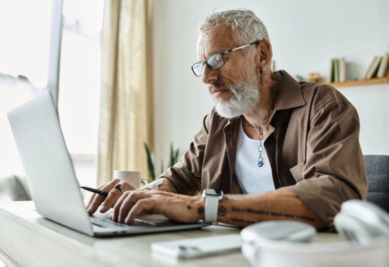 senior using the laptop to contact GMCE